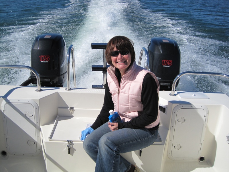 Linda in the cockpit as we cruise out into the gulf.  Amazingly calm day :-)