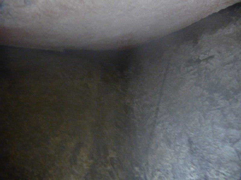 looking from within the hole, forward at the stem, and under the anchor locker.