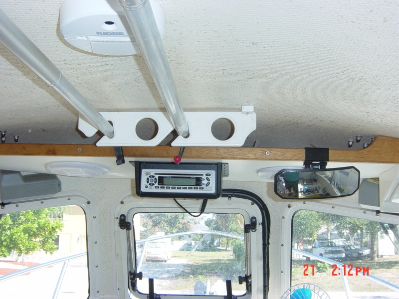 Looking up at  the shelf it holds am/fm  cd radio ,plus rod holders or boat hooks. the cape cruiser has a shelf but   no headliner like the venture.