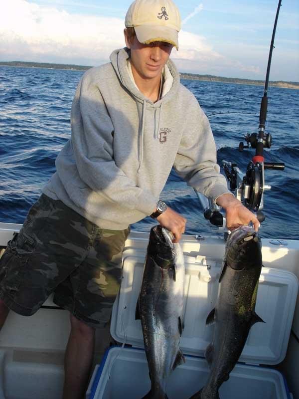 Luke with his two salmon, he cleaned his own!