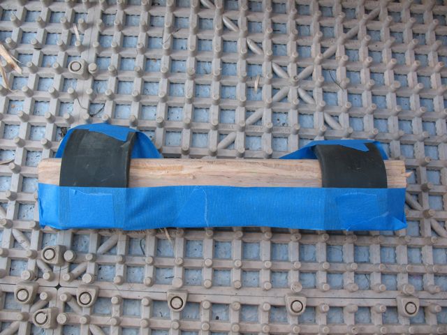 Made a new wedge out of materials I had with me on the road (1" x 2" scrap, planed top edge at 45? to contact motor better than the original, "sharp" edge).