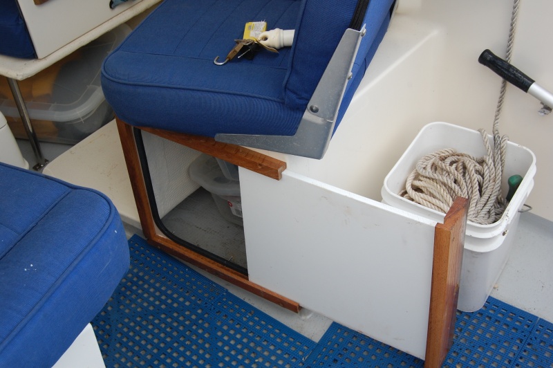 Made of starboard and mahogany. Door slides completely out and can be used as cutting board