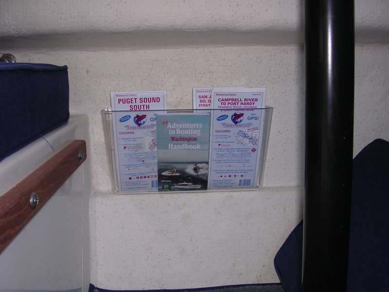 Magazine rack under dinnette.  It\'s a plastic document holder from Office Depot.  The kind that offices attach to office doors.