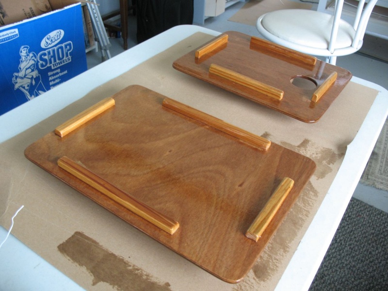 Making a set of "usable mock-up from scrap" cover boards for the sink and former-Wallas hole in the galley counter.  Two sheets of scrap 1/8" ply epoxied together to make 1/4", then cut and cleats affixed to the bottom side to hold them in place, and then varnished.  Turns out they make sort of handy "butler's trays" when used upside down at anchor.