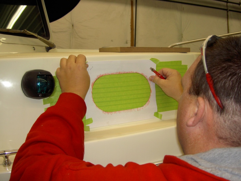 Making a template and positioning.  Masking tape to prevent gel coat chipping.