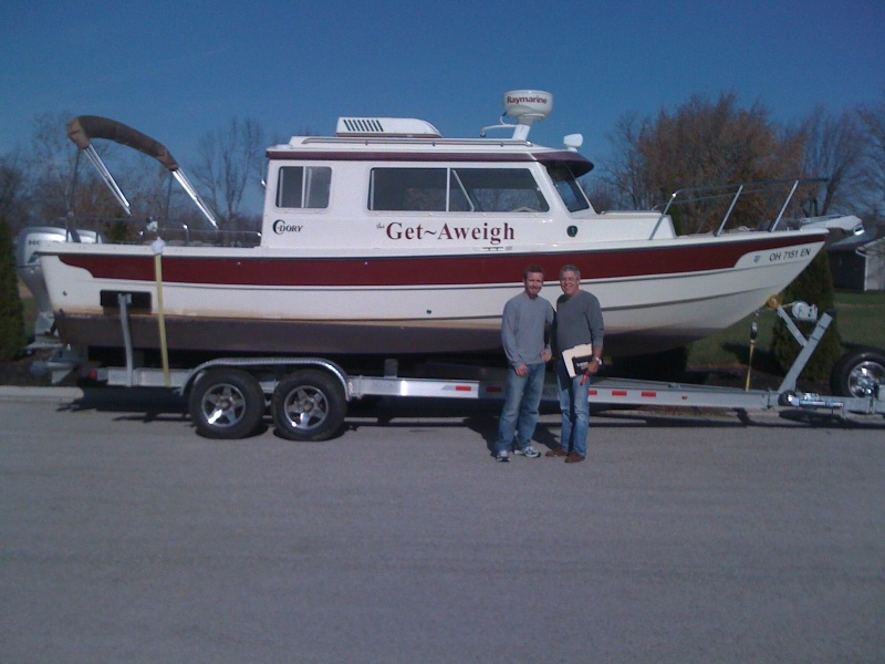 Marc and his son Landon prepare to take the Get~Aweigh to her new home in Northern Alabama.