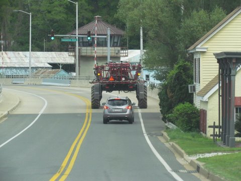 May 1st is planting time, huge fertilizer spreader crossing the Sassafras