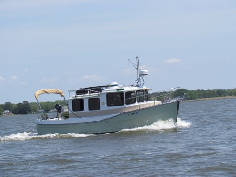 Mike and Jess Rizzo's Illusion a 27' Ranger Tug,this boat is fully equipped,flat screen, freezer refridge,A.C. Webasco heater,a full compliment of electronics,busts thru 3 footers like it was warm butter