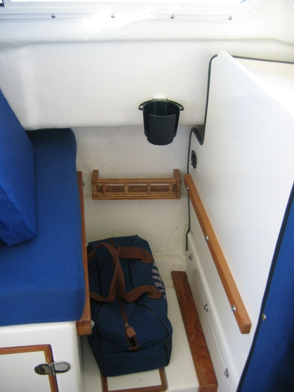 Mini-shelf added next to port and starboard seats