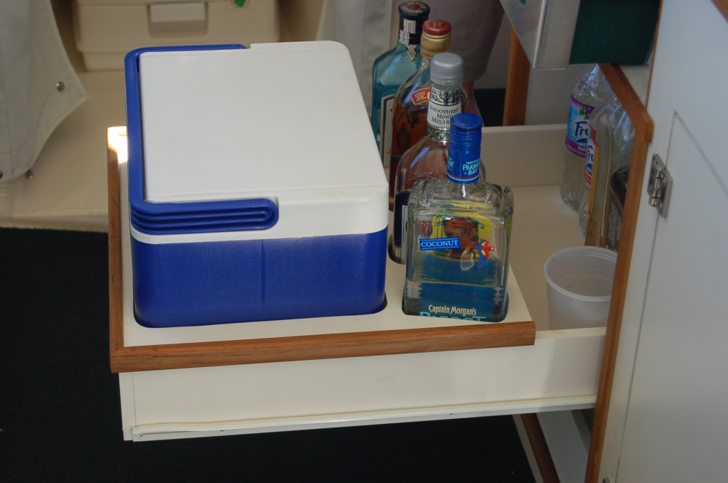 (Minnie Swann) Top drawer is ice bucket and liquor cabinet