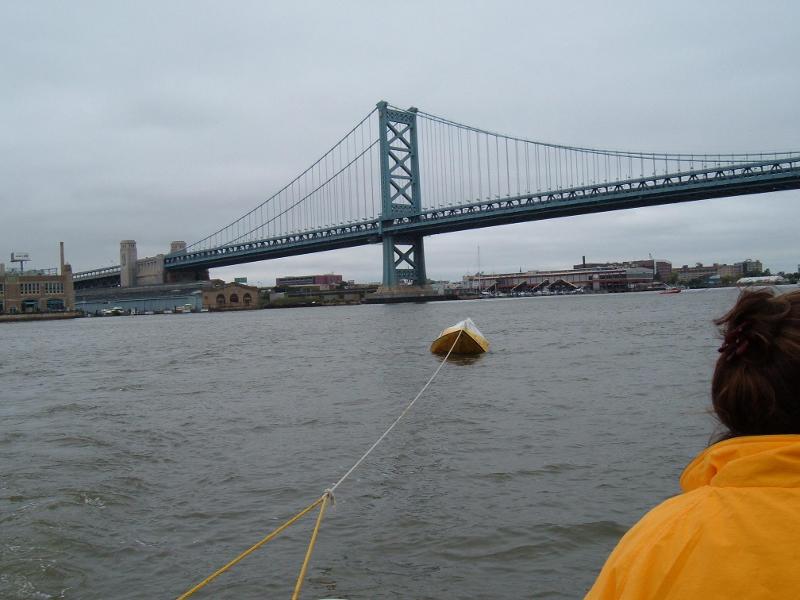 (Minnow) The tough way to tow a boat, knife at the ready in case it looses air.
