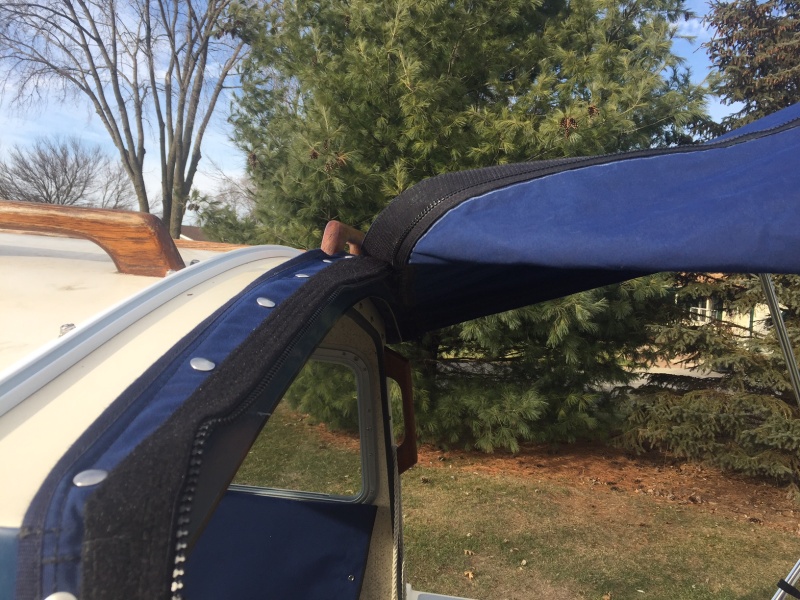 Modify Bimini with two zippers.  Easier to get in/out with bimini installed.