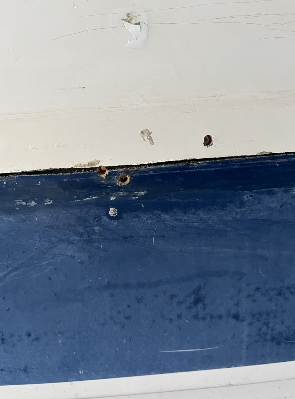 more holes under rub rail.  Like this the whole way.