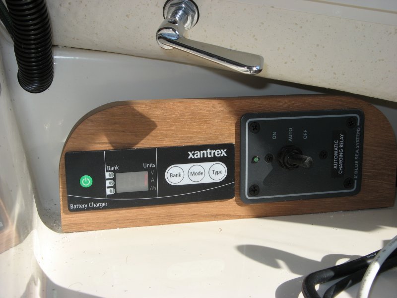 Mount for charger remote and BlueSea 7600 ACR control.