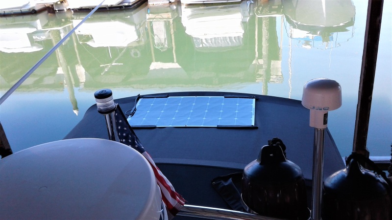 Mounting a 100w solar panel on your bimini as shown will give you full sun access and will allow you to fold bimini against bulkhead for fishing.  It can also be easily removed if desired if mounted correctly