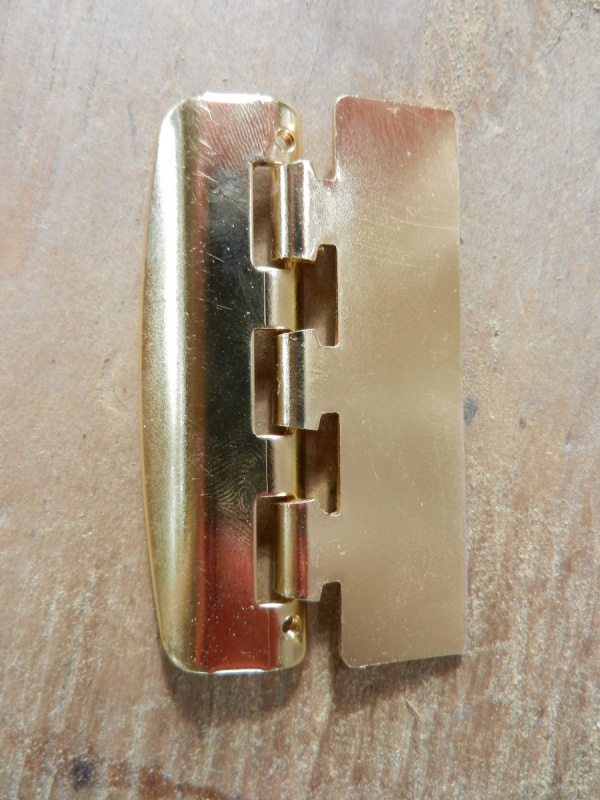 Mounting tab cut off to match cabinet edge depth