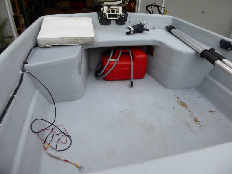 Needs some touch-up interior paint. You can see a couple of test patches I did on the starboard side rear seat with Interlux Interdeck.  Looks pretty good, Think I'll do the whole thing. Wires for fish finder installed by previous owner. Long shaft transom!