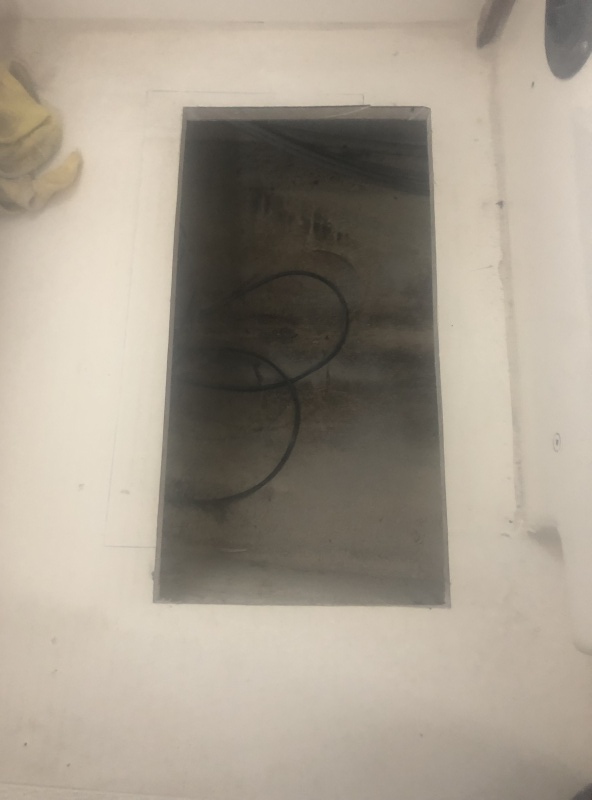 New Hole for access hatch to New Battery Location. Predrilled oversize Holes for access hatch hold down and filled with Epoxy as well as edges from cut opening