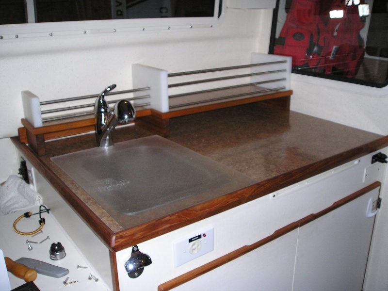 New laminate counter top and raised rack, new faucet