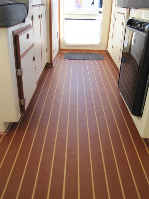 New teak laminate flooring installed by the folks at Wefings.  Really attractive and nicely finished