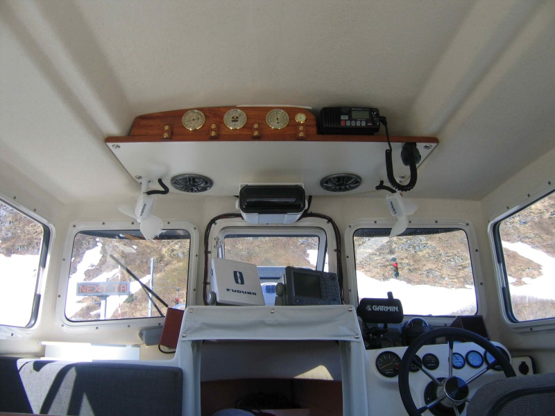 New Work 2007 - Installed Stereo + Speakers, 2 12 V fans (work wonders for condensation), Built Weather Station (barometer, thermometer, hygrometer and clock)Wood is African Mahogany