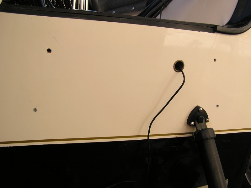 Nice and clean.  Some "GOOF-OFF", a single edged razor & elbow grease did the trick.  Very minimal damage to the gelcoat; a few scratches but nothing major.  Now to repair the holes & re-gelcoat prior to kicker install.  The wire for the transducer will also be properly installed; I didn't want it to interfere w/ the Mini-Jacker.