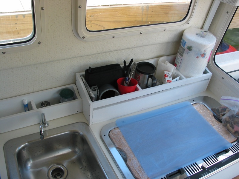 (Not For Hire) Starboard boxes fit behind sink and stove.