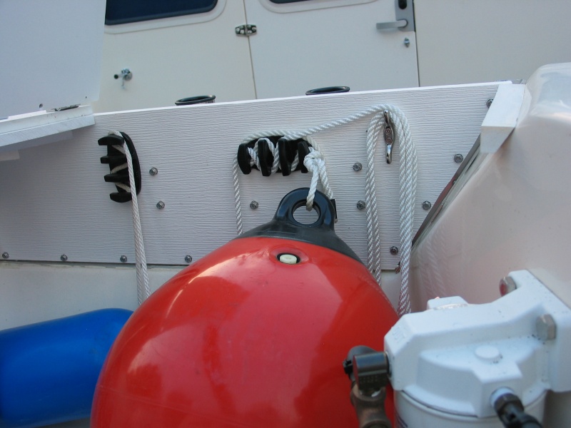 (Not For Hire) Wave barrier board shelf from stern showing handy z-grip cleat to hold fenders in place, etc.