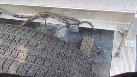 Note brake hoses sleeved in clear plastic tubing and tie wrapped to prevent rub through.