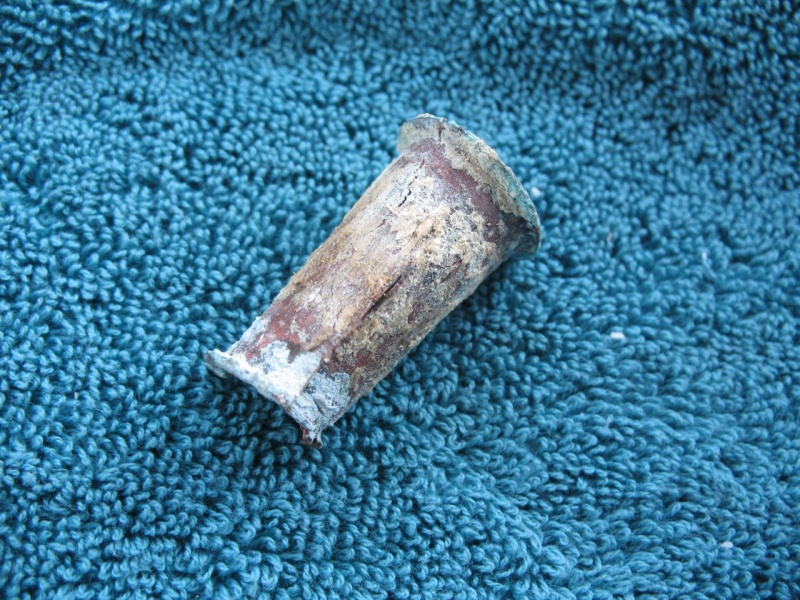 Old brass transom drain tube, removed.  As you can see, the sealant was scanty at best.