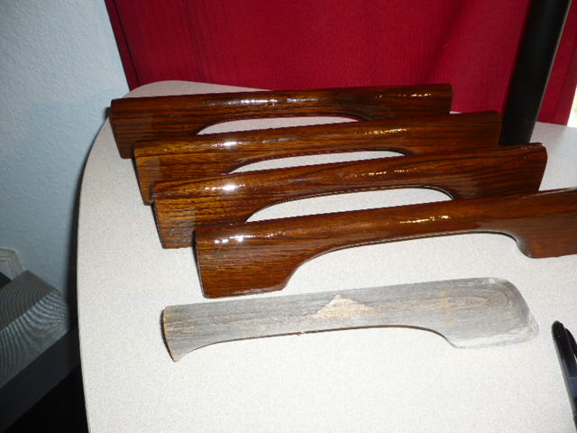 Old handhold weathered piece in foreground. 4 cuts from old roof mount salvaged and restored by sanding, adding gunstock stain and 9 coats of urethane.