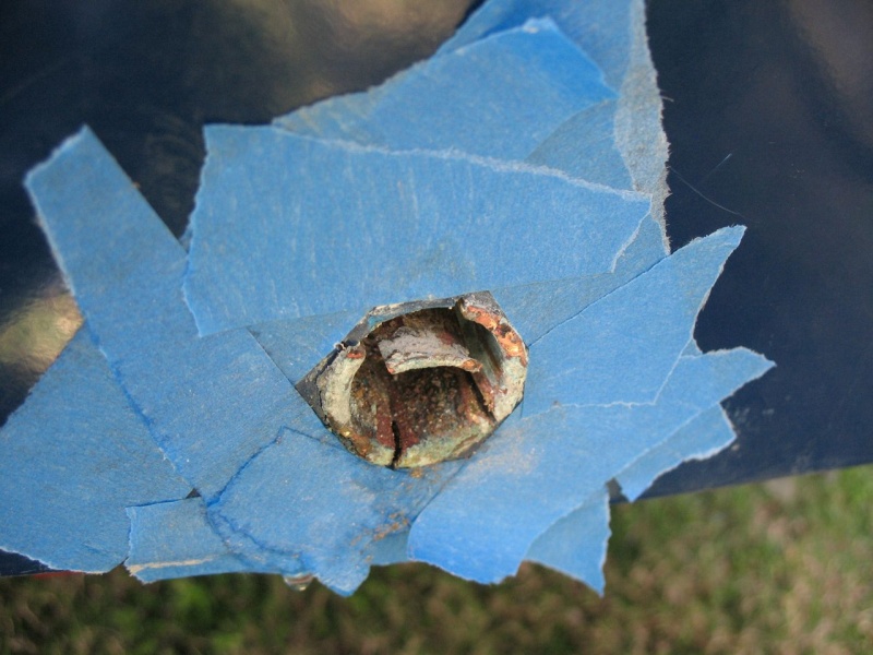 Old tube, section tapped down with cold chisel, after which I grabbed it with vise grips and pulled it out.