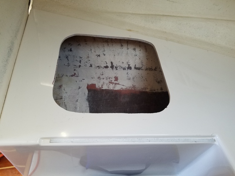 One of two cutouts under the V berth cushions. I traced around the frame, and cut it out with a jig saw, using a metal cutting blade.