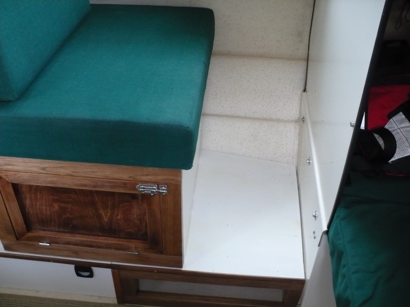 Open storage under foot. I used porch paint and a clear coat on the raised floor decking. It's held up good after 2 seasons.