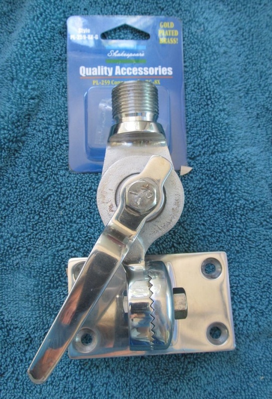 Original antenna mount. I cleaned this mount up and reused it for my new antenna. (Box in background contained new cable connector part, but contents are not shown.)