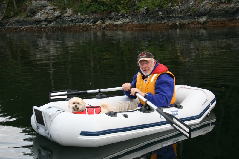 Our Tender "Guppy" with Ross and CoCo. A 2004 7'-3" x 3'-9" Ax Bombard inflatable. 1'-1" tube diameter, 33 lbs. and powered by a 2 hp. Honda 4 stroke.