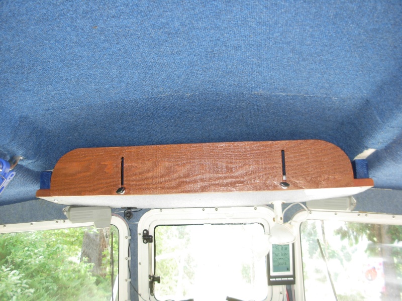 Overhead storage in closed position.  Wing nuts alow it to be locked in place.
Most of inside of boat is covered w/ headliner/ indoor/ outdoor carpet which serves two purposes:  Insulation and condensensation prevention, and something velcro "hooks" will cling to.