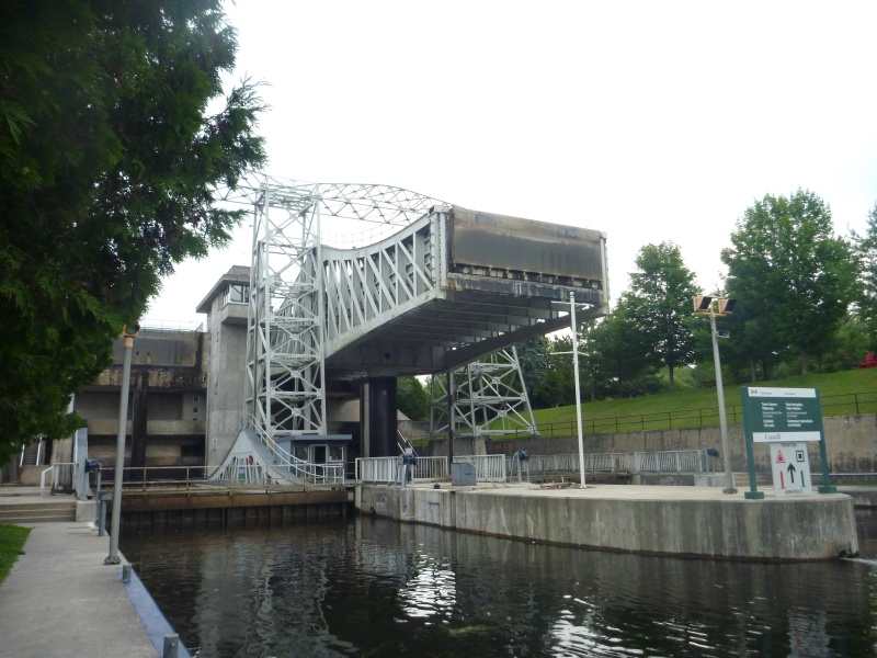 P1020368 Now we are down tied up to the locks wall. This engineering made me feel real stupid