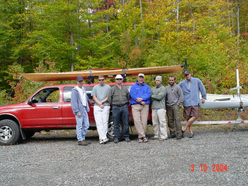 Packing up to return to civilization. Yours truly is the the old man in the middle with the blue fleece. My sons are second from the left and third from the right. My boys and I all paddle boats that we built.