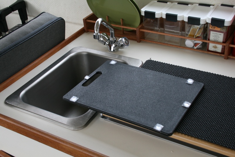 Pads glued on to keep the cutting board in place while underway