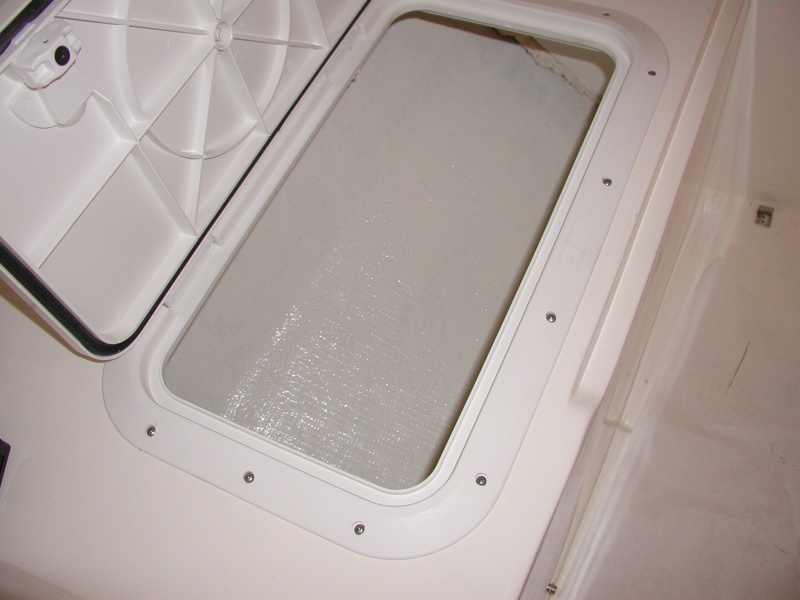 Painted with West Marine Starbrite and bedded the hatch with 4200.I figure the hatches will hold air as floatation for a while.