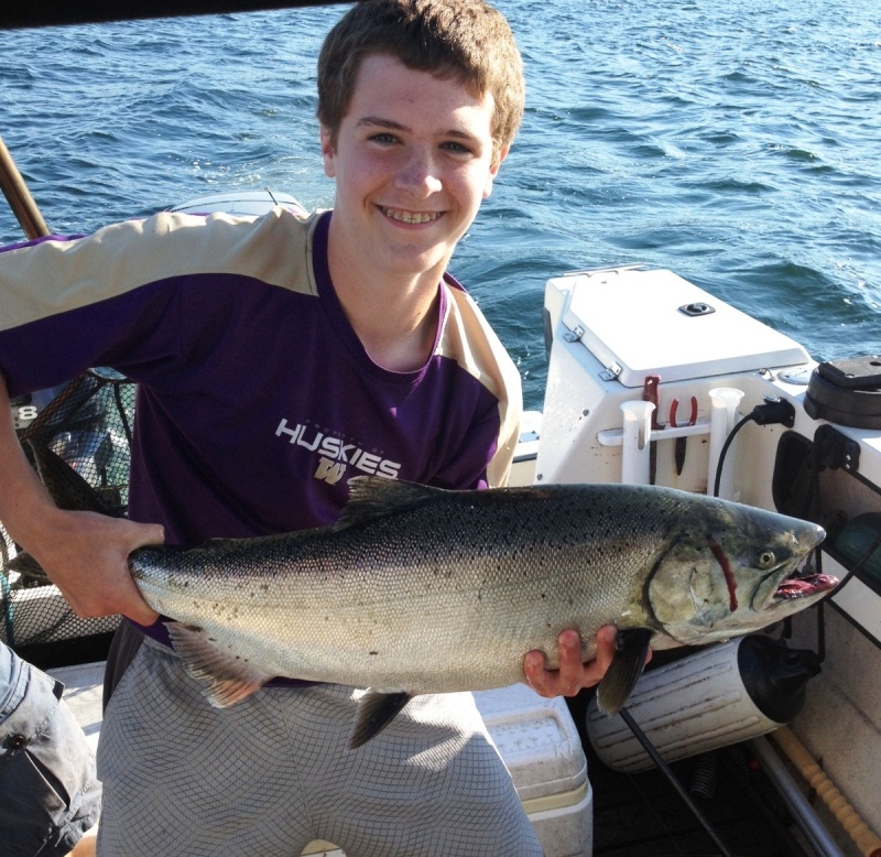 Parker's best king yet.  4" cookies & cream close to the bottom in ~100' of water close to Pt no Pt.  Also, got a nice hatchery coho @ 55' with a freshly tied white UV squid.  bonus 2 crabs.  Great Day 7/26/14