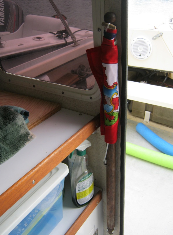 Picture is really of the furled flag and mast, clipped to bulkhead with Beckson clips. Wonderful things those clips.