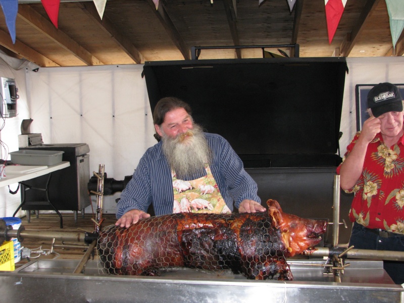 Pierre showing off the roast pig