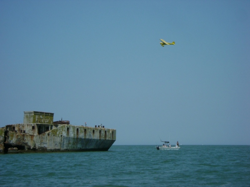 Pilot checking out the concrete boats and fishermen