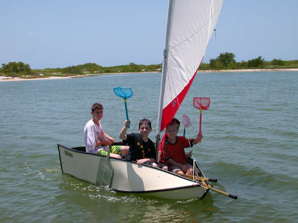 Pirates in training!!! Good shot of our fold up dingy. There are 4 kids 
aboard.