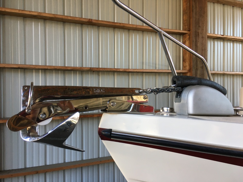 Pivoting bow roller and anchor safety strap