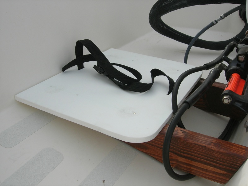 Platform set on, with the brass screws (tops removed)used to hold the platform in place.  All 3 pieces are completely separate which allows for easy setup, removal, and storage.  Nothing is attached to or screwed into the boat.