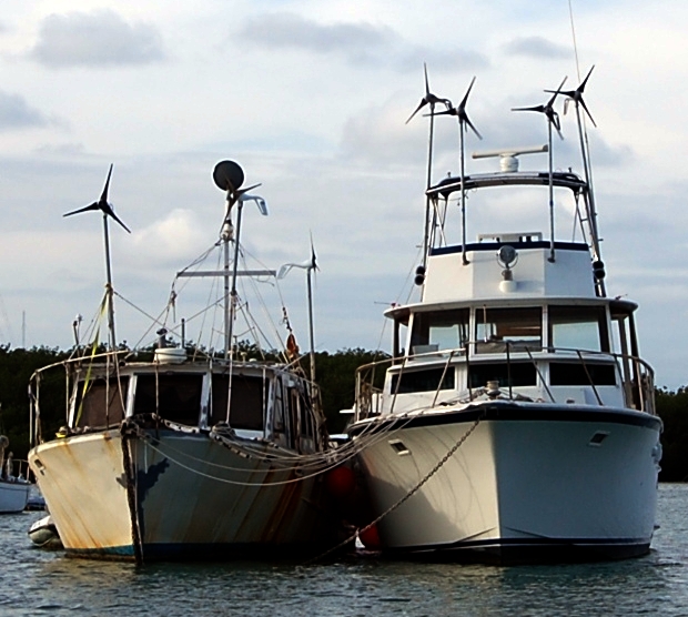 Please take note: 7 wind generators and blacked out windows....wonder what is going on with these boats. Anyone want to take a wild guess?