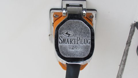 Plug cover is designed to snap in place on the back of the shore power cord's plug.